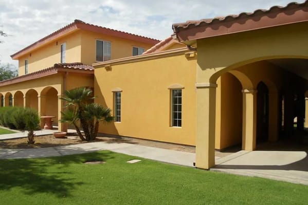 Exterior view of Pennington Gardens with archways and landscaping