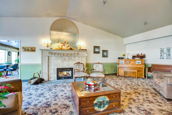 Living room with comfortable seating and a fireplace