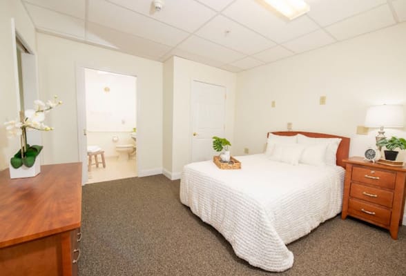 Cozy, well-decorated resident room with a bed and furniture