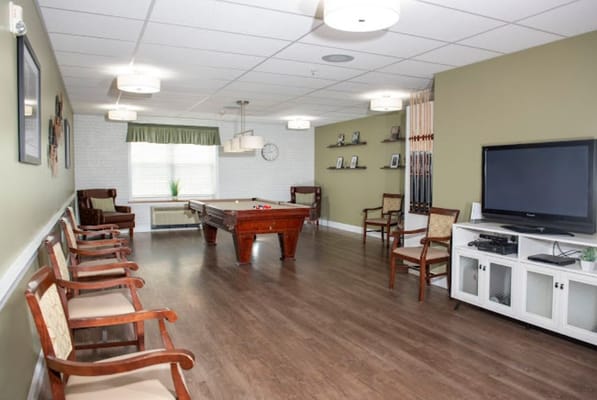 Activity room with pool table and seating
