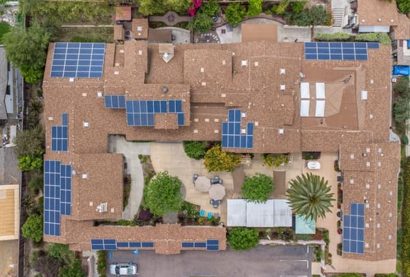Aerial view of a senior living facility with solar panels