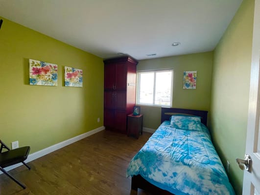 Cozy private bedroom with floral decorations