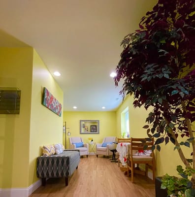 Bright interior common area with seating and plants