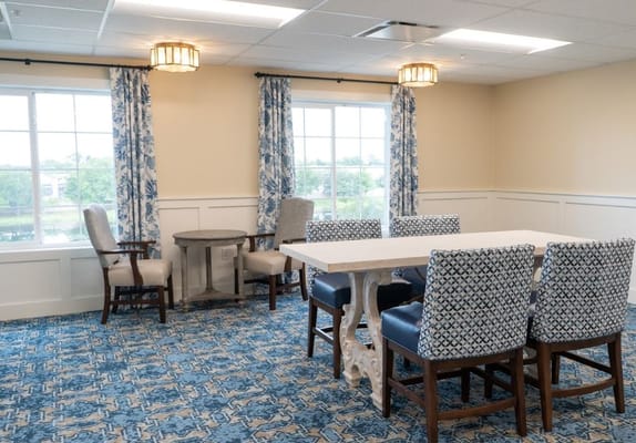 Bright common area with seating and tables