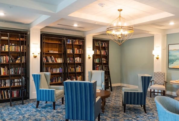 Cozy library area with bookshelves and seating