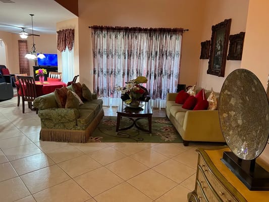 Elegant living room with comfortable sofas and dining area