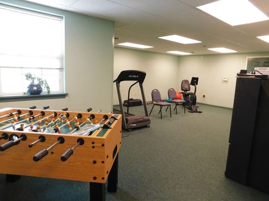 Interior view of a recreational room with equipment