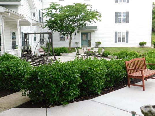 Well-maintained outdoor space with seating and greenery