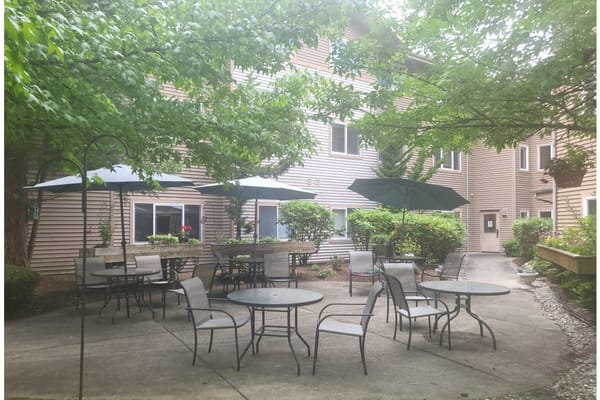 Seating area in the outdoor garden of Stafford Suites