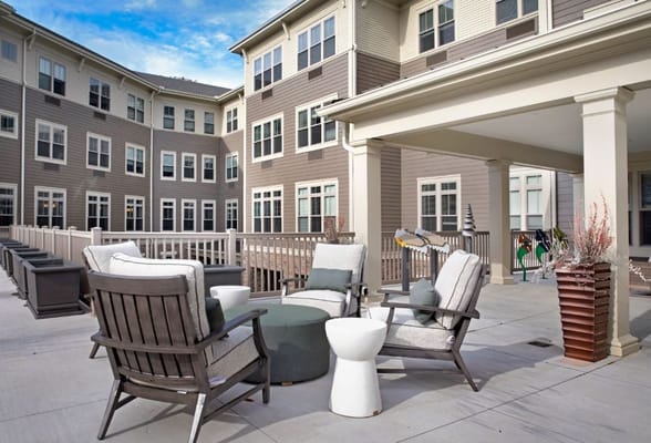 Comfortable patio seating with a view of the building