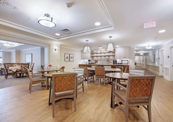 Cozy dining area with wooden tables and chairs