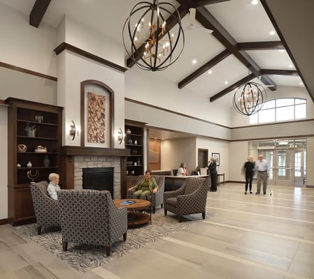 Cozy lobby with seating area and front desk at Trinity Woods