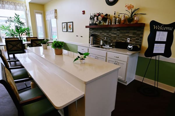 Lounge with a white countertop, seating, and a welcoming decor