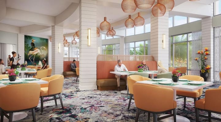 Spacious dining area with residents enjoying meals