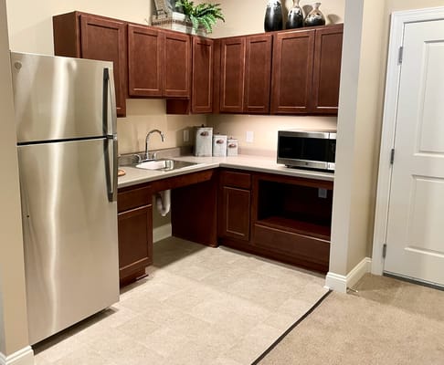 Modern kitchen with stainless steel appliances and wooden cabinets