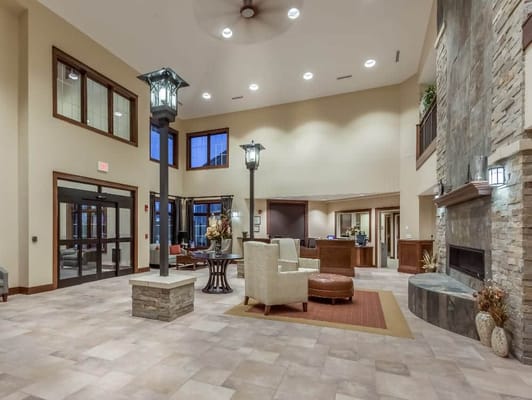 Spacious and modern lobby with seating and fireplace