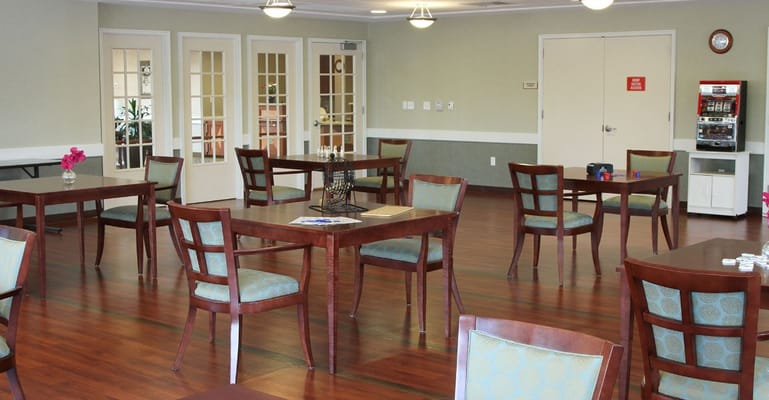 Spacious common area with tables and chairs