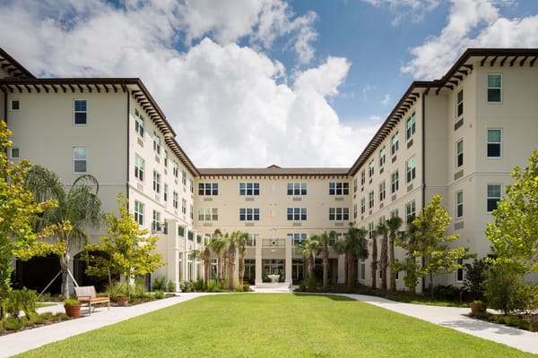 Lush courtyard surrounded by residential buildings