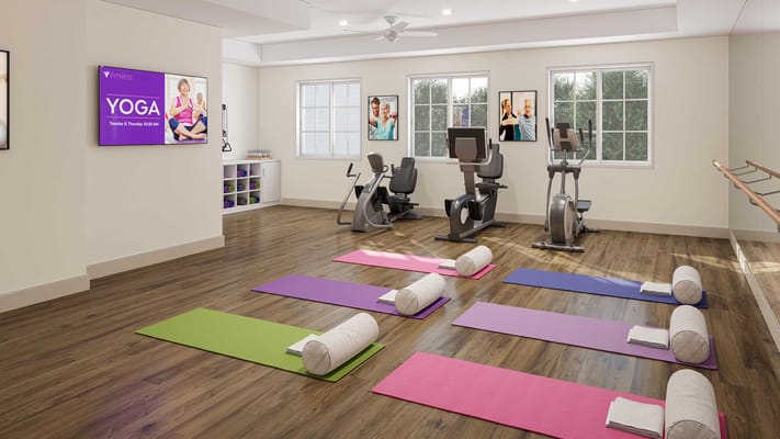 Interior view of a fitness studio with yoga mats