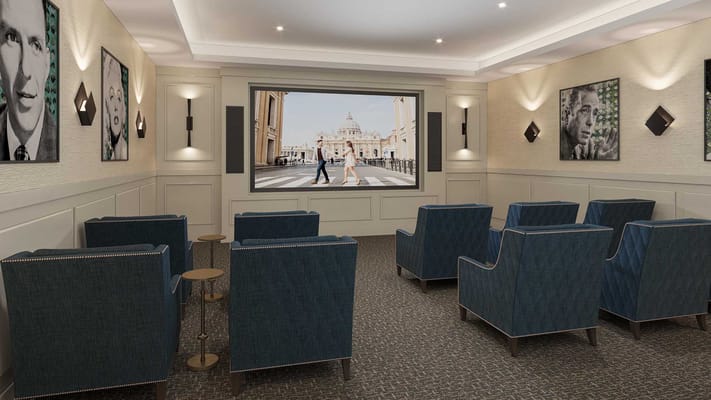 Interior of a media room with seating and large screen