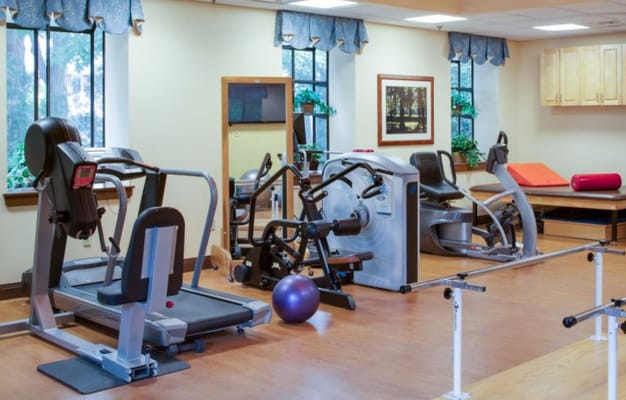 Rehabilitation gym with exercise equipment and therapy tools
