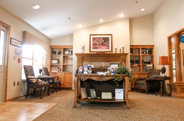 Cozy lobby area with seating and a reception desk