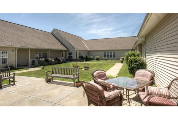Outdoor seating area with benches and a table