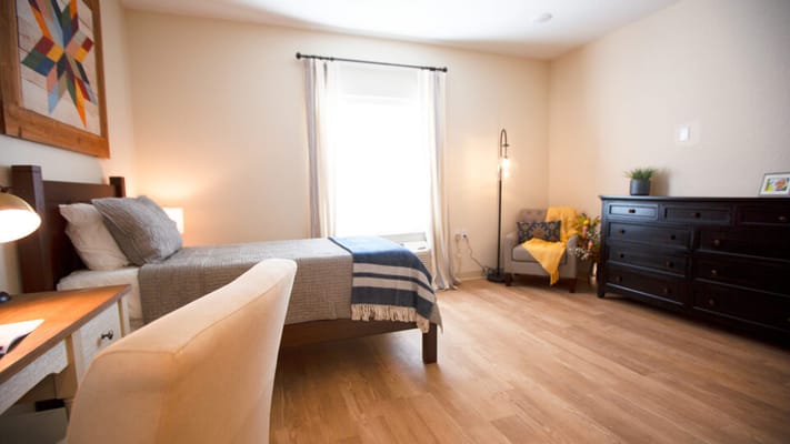 Comfortable private resident room with natural light