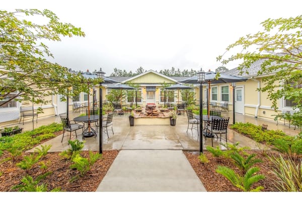 Well-maintained outdoor area with seating and plants