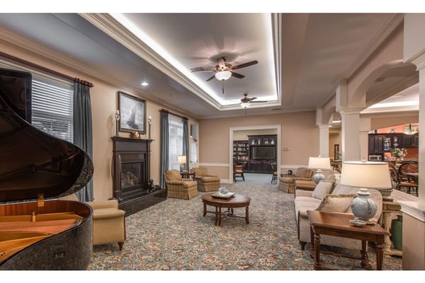 Cozy common area with seating and a piano