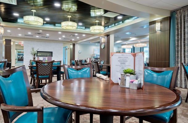 Interior view of a bright dining area in a senior living facility
