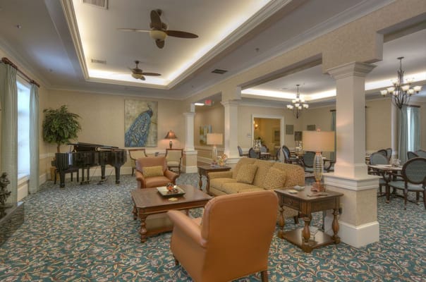 Common area with comfortable seating and piano