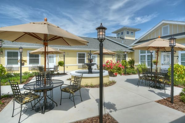 Outdoor patio area with seating and umbrellas