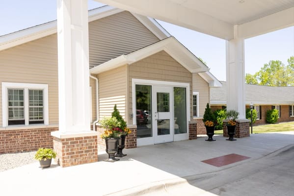 Exterior view of the main entrance at a senior living facility