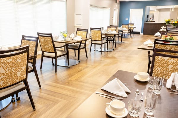 Dining area with tables set for residents