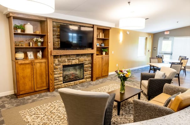 Interior view of a cozy lounge area with a fireplace