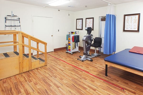 Therapy room with exercise equipment and stairs