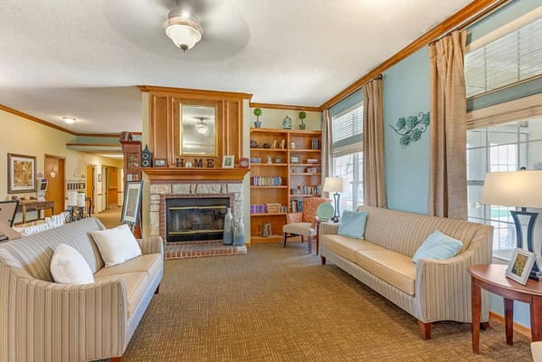 Bright and inviting common area with seating and bookshelves