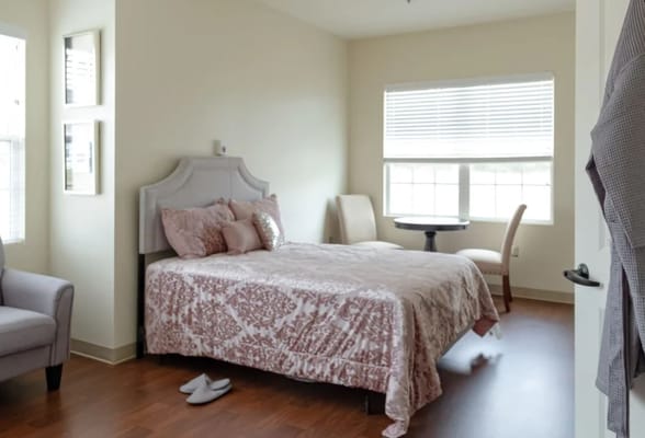 Cozy private room with a bed and seating area