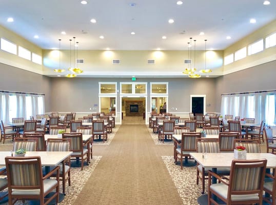 Spacious dining room with tables and chairs at The Lodge in Sisters