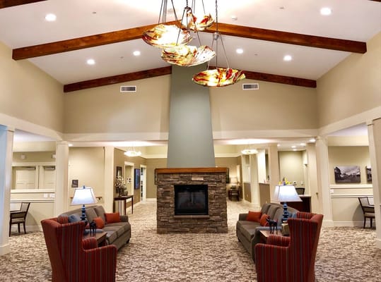 Spacious lobby with a fireplace and seating area at The Lodge in Sisters