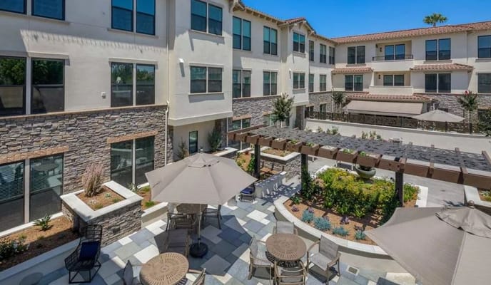 Outdoor courtyard with seating and landscaping