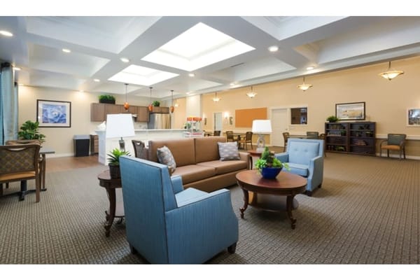 Bright common area with comfortable seating and natural light