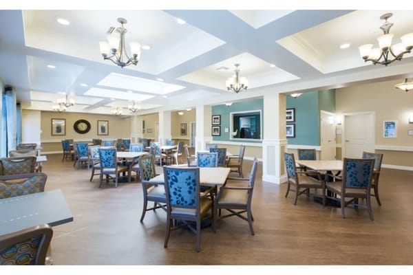 Bright dining area with tables and chairs