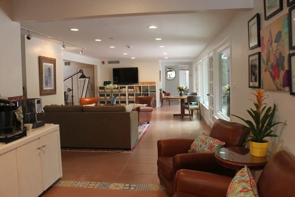 Bright interior common area with seating and decor