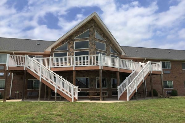 Exterior view of a senior living facility with a large deck