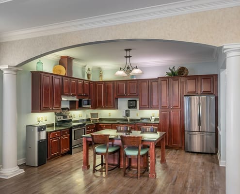 Bright kitchen area with wooden cabinets and modern appliances