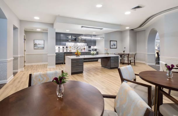 Contemporary kitchen and dining area featuring wooden tables and stylish decor