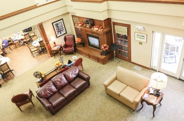 An inviting living room with sofas and a fireplace in Vintage Park at Tonganoxie.