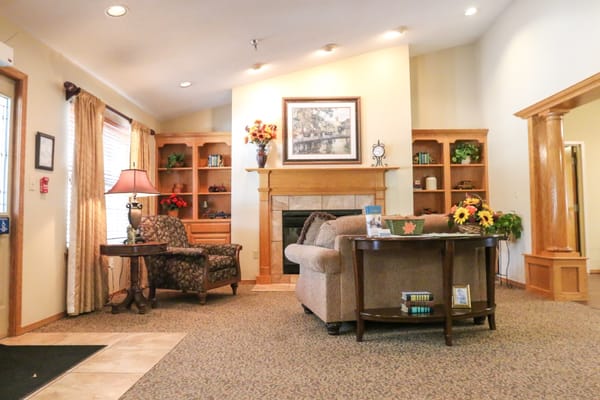 Cozy common area with seating and bookshelves